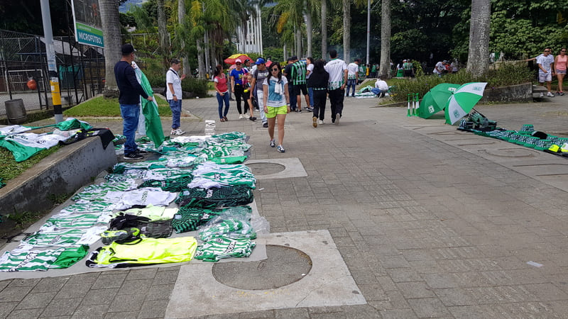selling nacional tshirt in front of the stadium